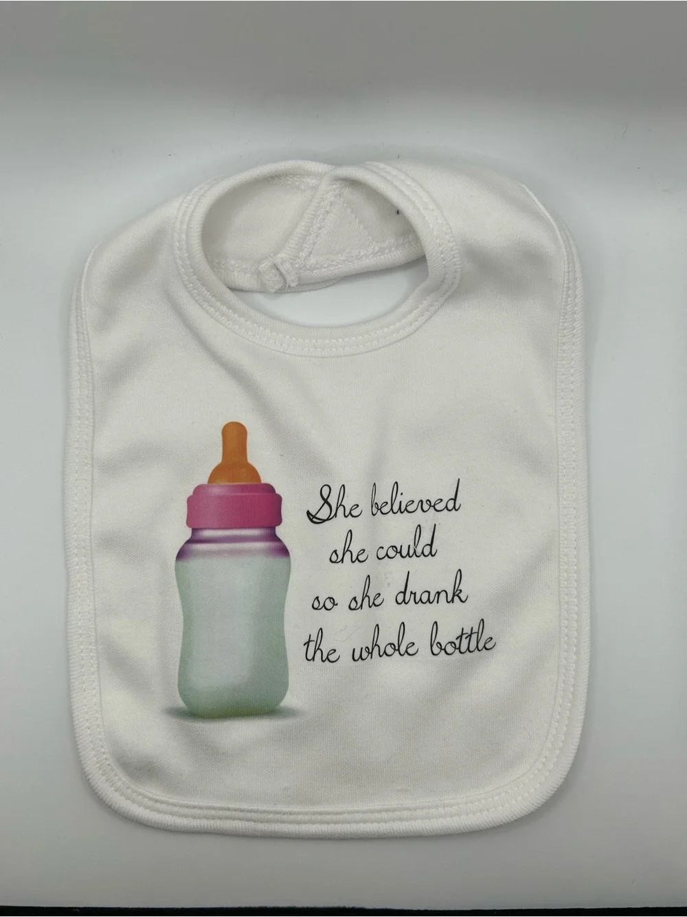 NWOT Cute White Baby Bib with Bottle Graphic and Quote